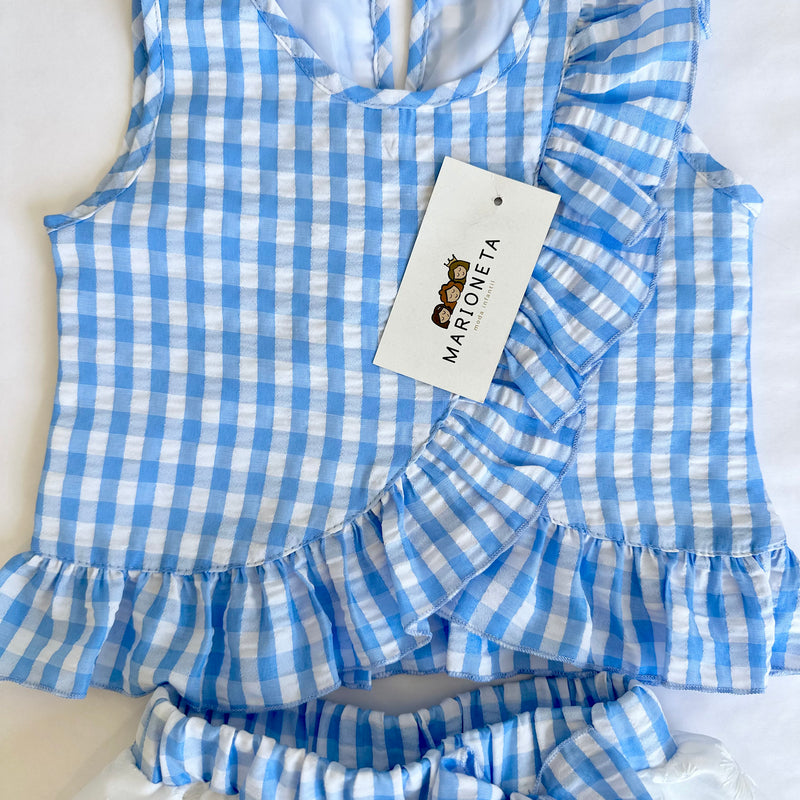 Conjunto dos piezas blusa azul de cuadros y falda blanca con cinto al color de la blusa para niña |