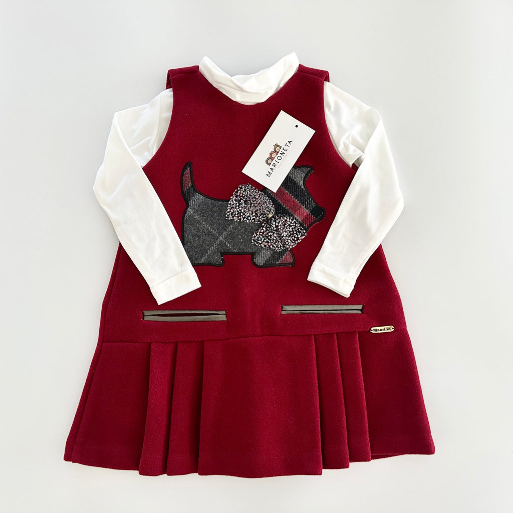 Jumper color tinto con estampado al frente de perrito para niña.