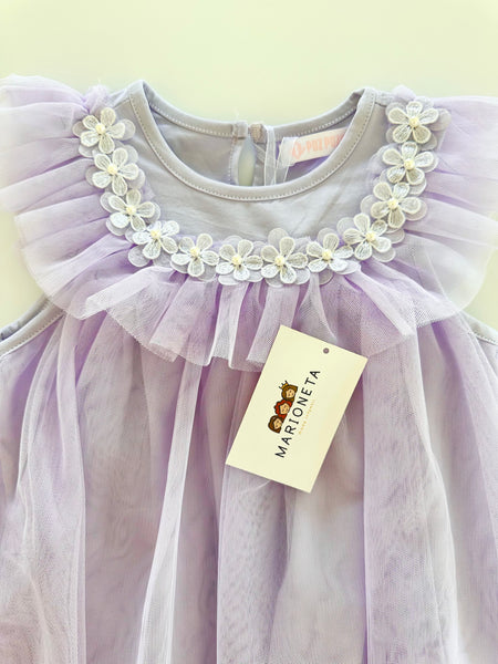 Vestido con florecitas blancas y olan al frente color morado lila para niña|