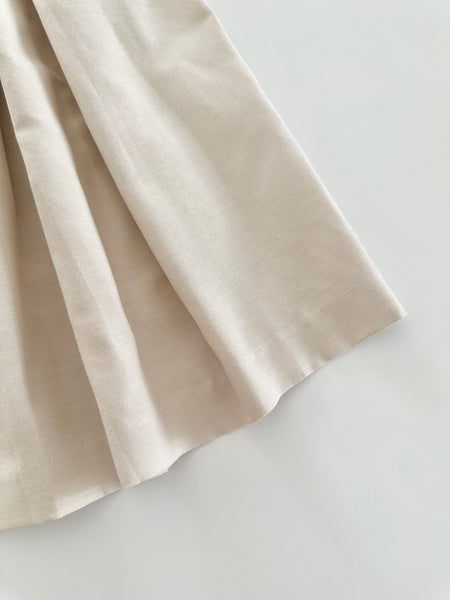 Vestido jesucito bordado a  mano color biege con bordado rosita para bebe niña.