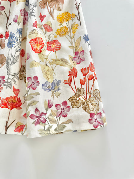 Vestido  jesucito bordado a mano floreado color naranja para niña |