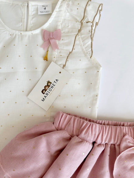 Conjunto dos piezas blusa blanca con olanes y puntitos dorados y falda de olanes con puntitos palo de rosa para niña.