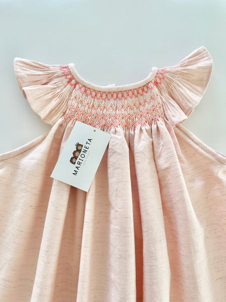 Vestido bordado jesucito hecho a mano color rosa salmon para niña.