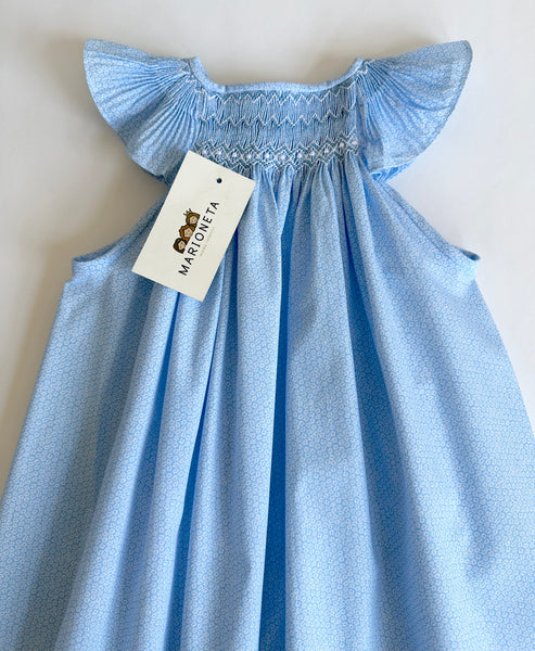 Vestido bordado hecho a mano jesucito color azul estampado con florecitas blacas para niña.