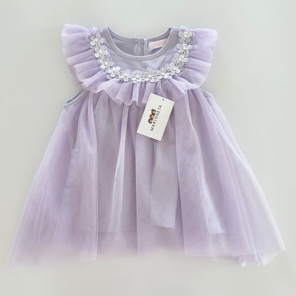 Vestido con florecitas blancas y olan al frente color morado lila para niña|