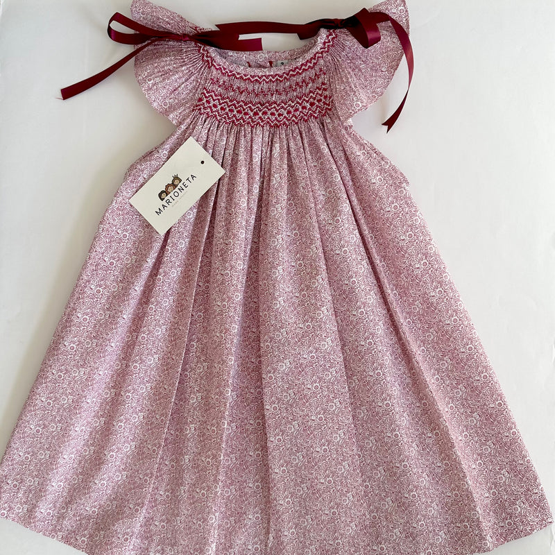 Vestido jesucito bordado hecho a mano color rojo con estampado de florecitas y lazos en los hombros para niña |