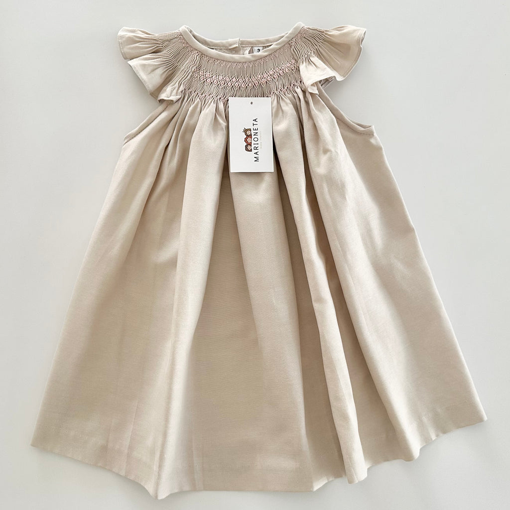 Vestido jesucito bordado a  mano color biege con bordado rosita para bebe niña.