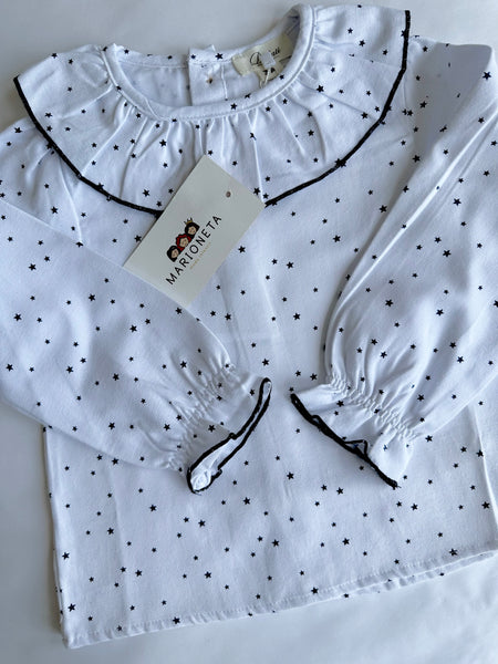 Jumpers marino con adorno de estrella y blusa blanca estampada de estrellas y volante al cuello para niña  Dadati