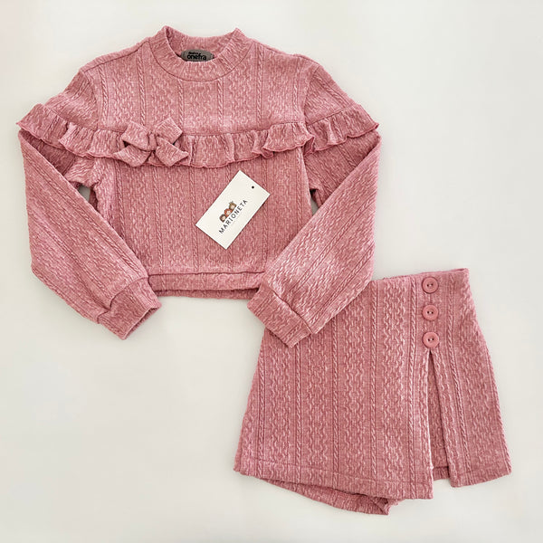 Conjunto dos piezas playera y falda short color rosa para niña.
