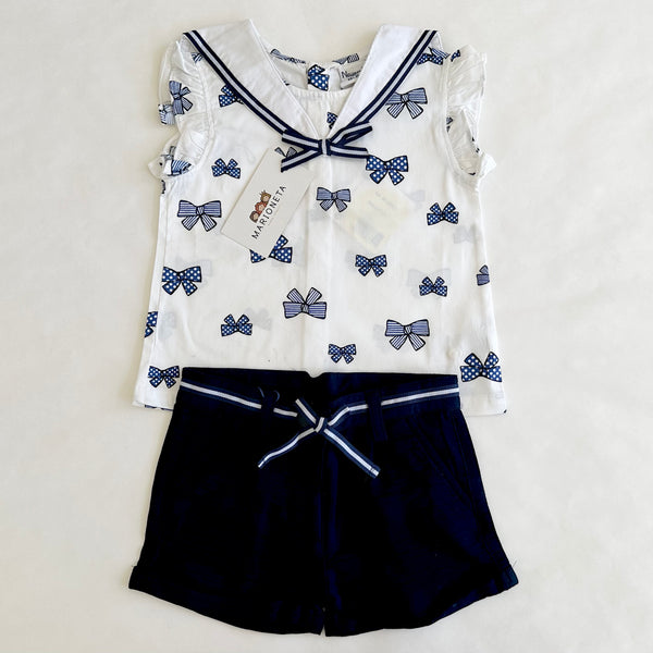 Conjunto dos piezas blusa blanca con estampado moños marino y short marino para bebe niña | Newness