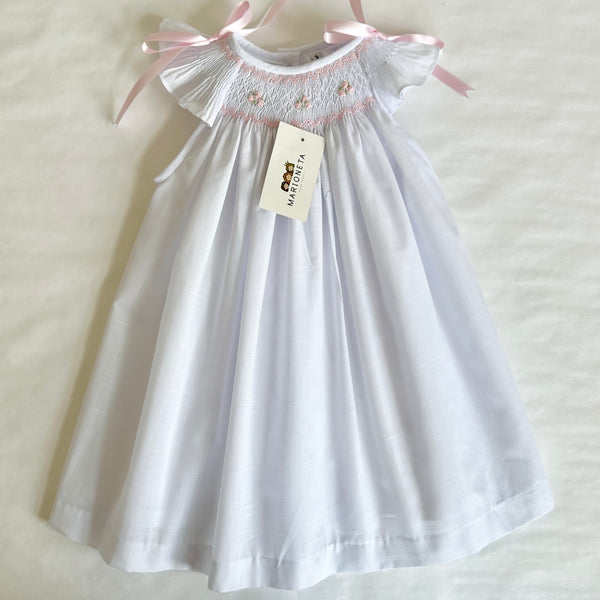 Vestido jesucito hecho a mano color blanco con bordado en tono de rosa para niña | CARPI