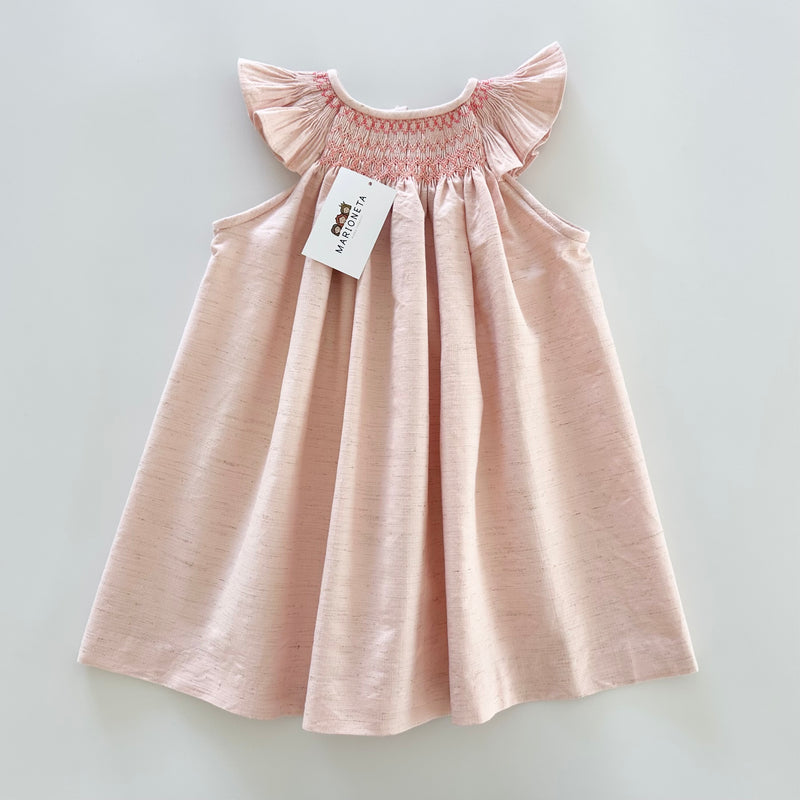 Vestido bordado jesucito hecho a mano color rosa salmon para niña.