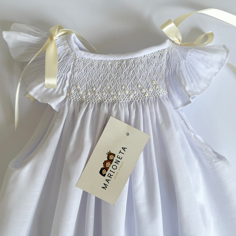 Vestido bordado jesucito color blanco con lazos y bordado color hueso para niña | Carpi