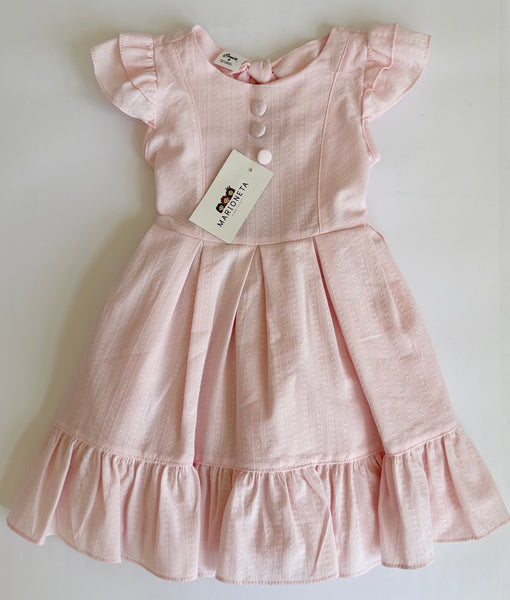 Vestido con detalle de botones y olanes color rosita para niña.