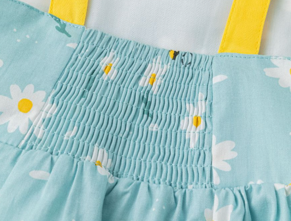 Vestido de niña de tirante lazo. En tejido azul estampado abejas, para niña | Newness