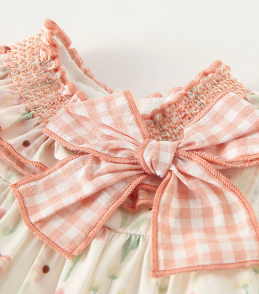 Vestido estampado color ivory con salmon, conb adorno de lazo al frente y braguita para bebe niña | NEWNESS