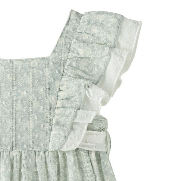 Vestido estampado color verde bajito con olanes en los hombros y lazo por la parte de atras para niña | NEWNESS