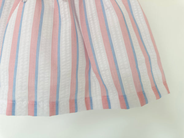 Vestido de rayas color rosa con blanco y azul con detalle de olan en la cintura para niña | MARCA MEXICANA