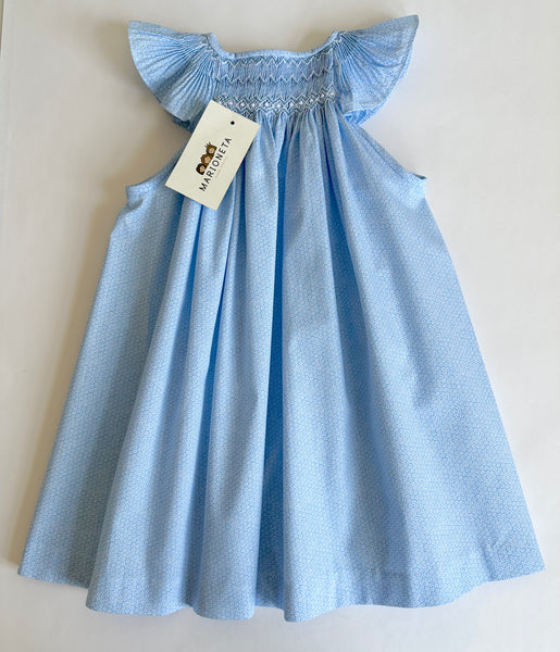 Vestido bordado hecho a mano jesucito color azul estampado con florecitas blacas para niña.