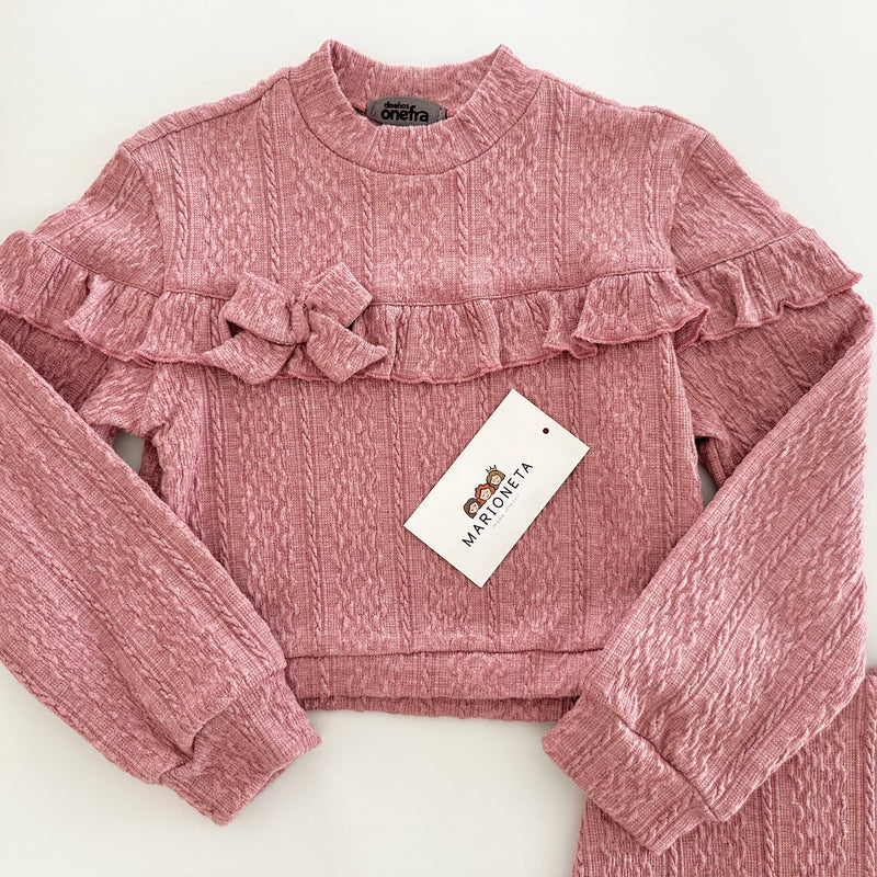 Conjunto dos piezas playera y falda short color rosa para niña.