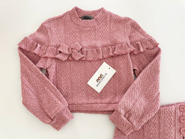 Conjunto dos piezas playera y falda short color rosa para niña.