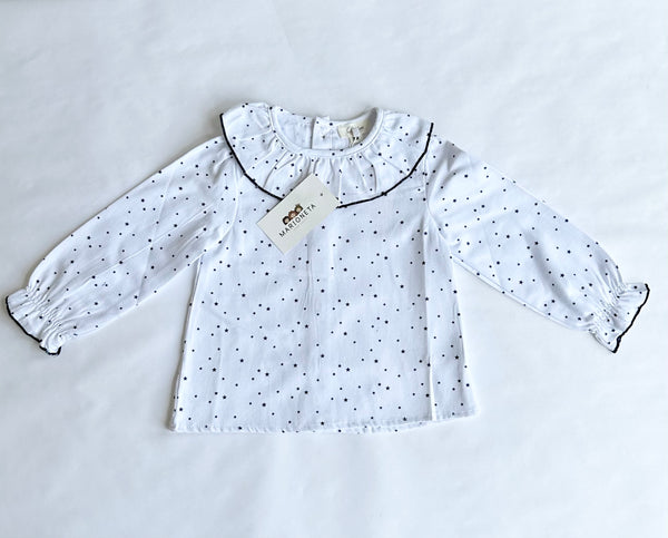 Jumpers marino con adorno de estrella y blusa blanca estampada de estrellas y volante al cuello para niña  Dadati