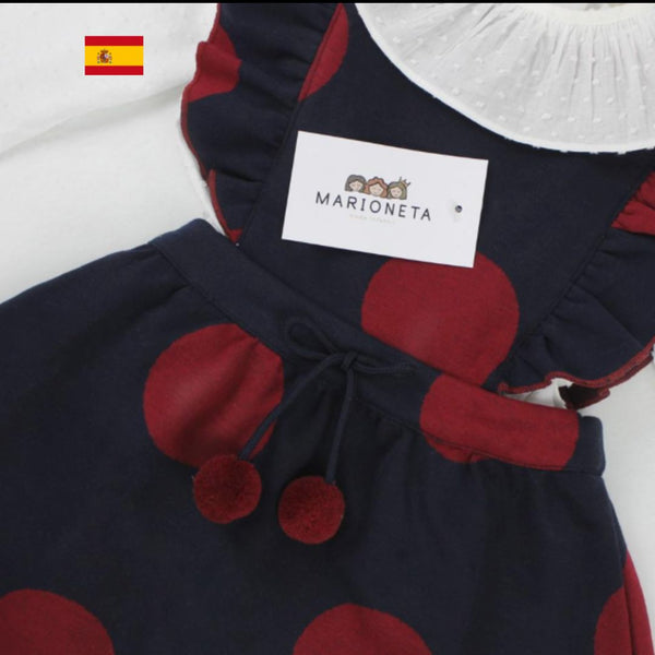 Pichi azul marino con lunares tinto y blusa blanca con volante para niña | Dadati