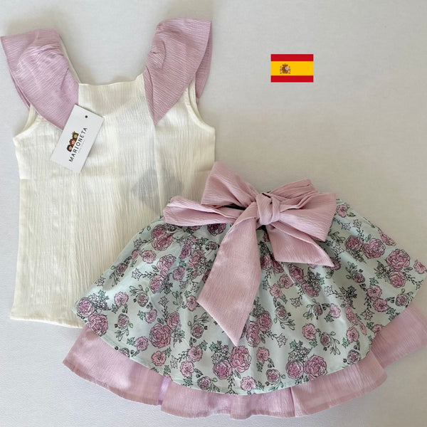 Conjunto de dos piezas falda estampada de flores y lazo al frente con blusa blanca con detalles en los hombros para niña | Newness