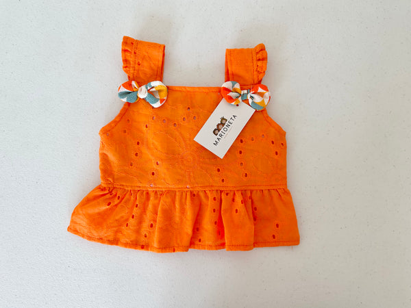 Conjunto dos piezas blusa de algodon  color naranja con detalles de moño al frente y short estampado para niña | Mexicana