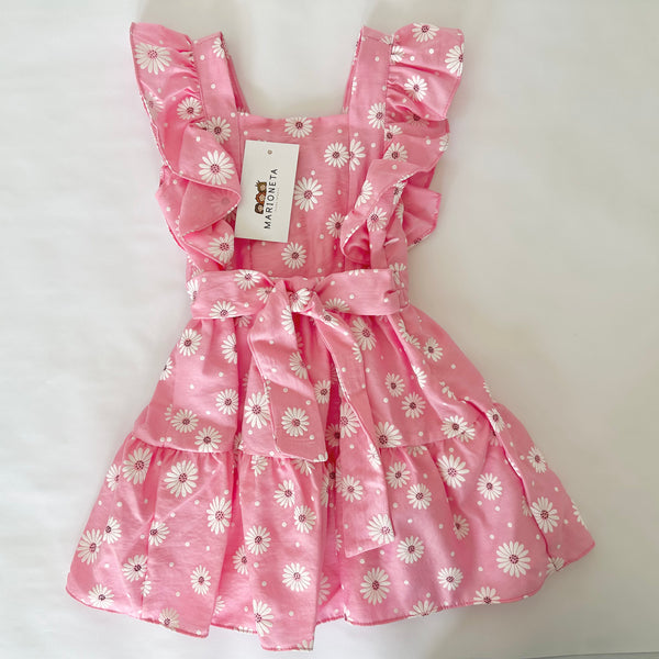 Vestido rosa con estampado de margaritas blancas con adorno de olanes y lazo atras para niña | mexicana