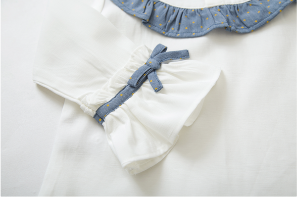 Conjunto dos piezas falda azul con faldon estampado oro y blusa blanca con detalles azules para niña | Newness