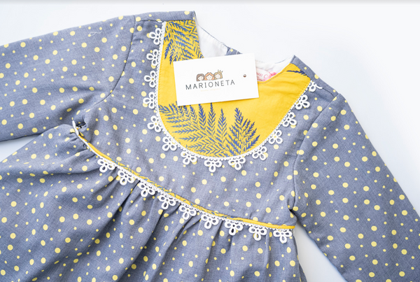 Vestido gris de puntos, combinado con amarillo manga larga para bebe niña |Newness .