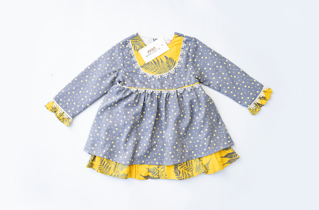 Vestido gris de puntos, combinado con amarillo manga larga para bebe niña |Newness .