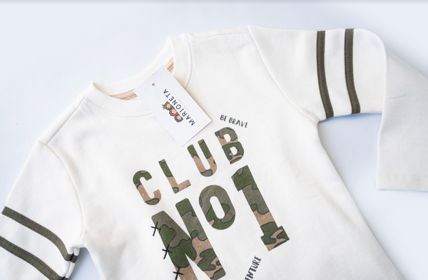 Playera  color beige con adornos al frente  para niño | Newness