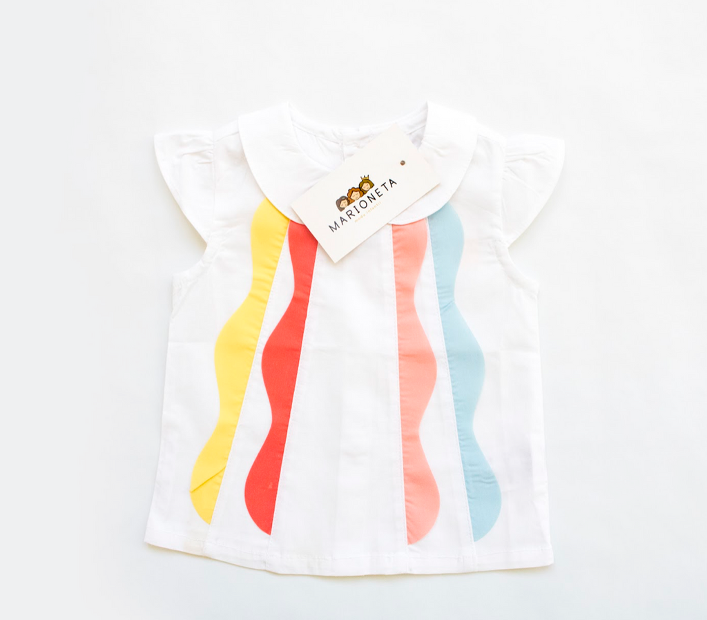 Blusa de manga corta, con volantes de colores en la parte del frente para bebe niña | Newness