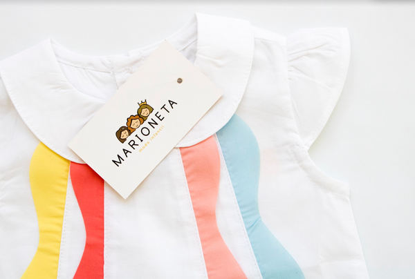 Blusa de manga corta, con volantes de colores en la parte del frente para bebe niña | Newness