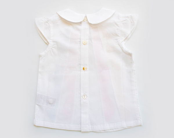 Blusa de manga corta, con volantes de colores en la parte del frente para bebe niña | Newness