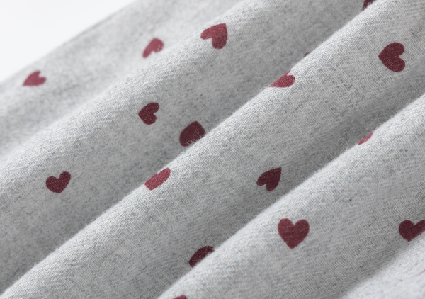 Vestido gris con estampado de corazones y adorno liston terciopelo para bebe niña | Newness