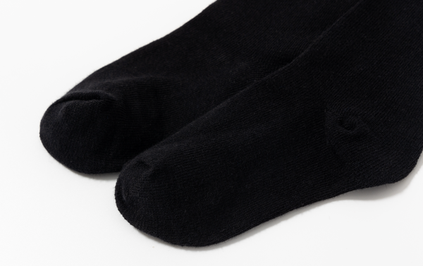 Medias con detalle de lazo color negro para niña | Newness