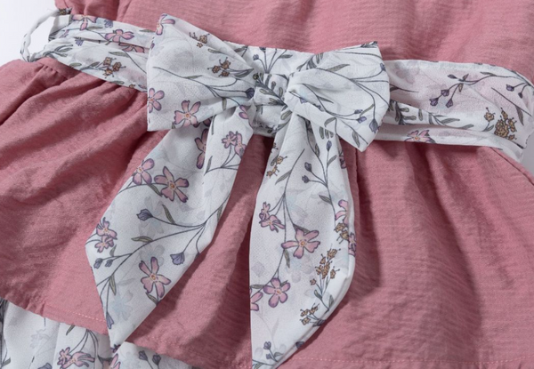 Vestido de vestir  rosa con tejido blanco con flores rosas y lazo por la parte de atras para niña | Newness