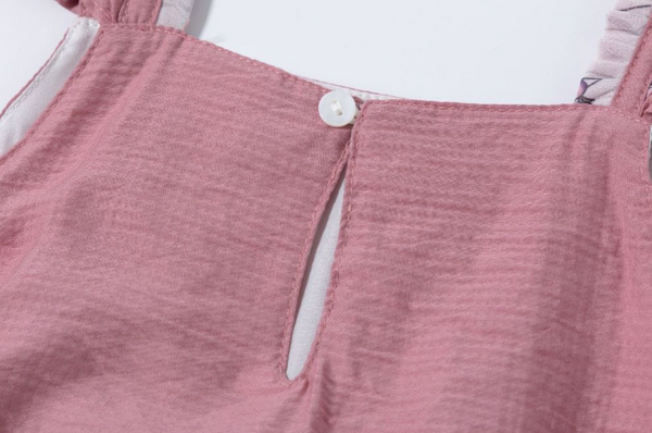 Vestido de vestir  rosa con tejido blanco con flores rosas y lazo por la parte de atras para niña | Newness