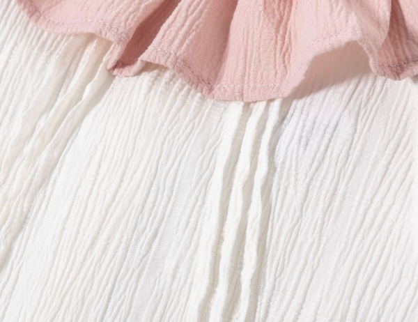 Conjunto dos piezas falda rosa dos colores estampada y blusa blanca con detalles al cuello de color rosa y estampado para niña | Newness
