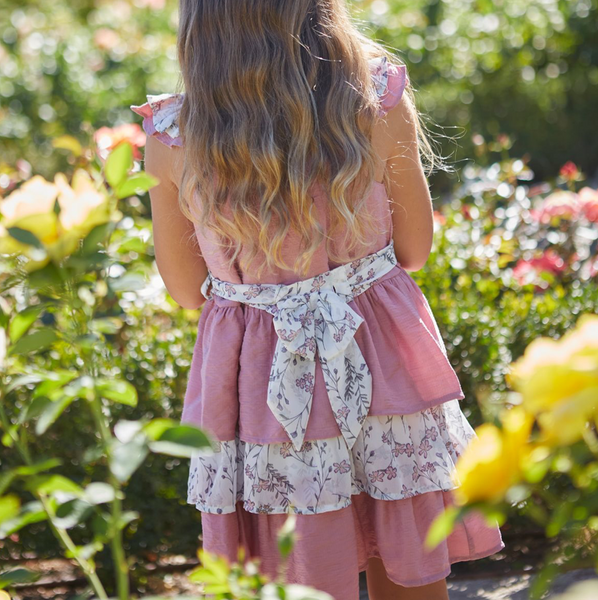 Vestido de vestir  rosa con tejido blanco con flores rosas y lazo por la parte de atras para niña | Newness