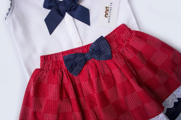 Conjunto dos piezas falda color rojo con azul marino y playera color blanco para niña| Newness