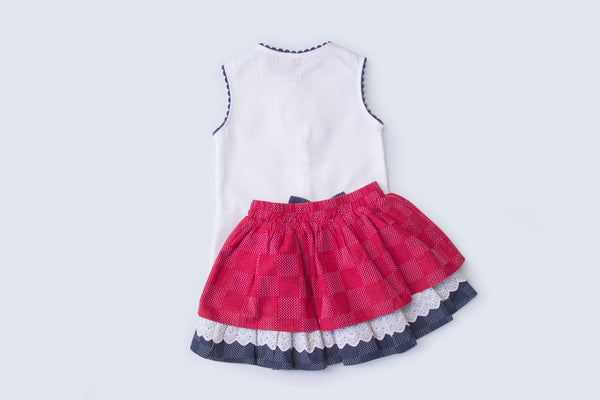 Conjunto dos piezas falda color rojo con azul marino y playera color blanco para niña| Newness