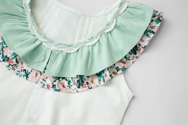 Conjunto dos piezas de falda color meta y flores y playera color blanco para niña| Newness