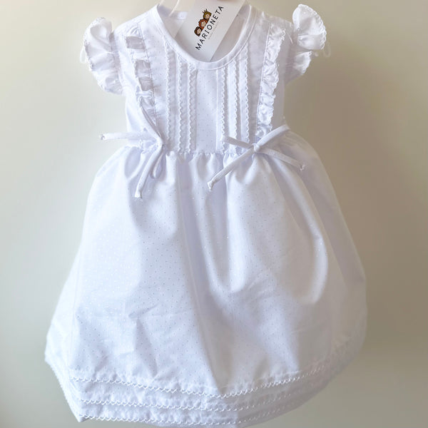 Vestido color blanco con detalles al  frente de lazos para niña | mexicana.