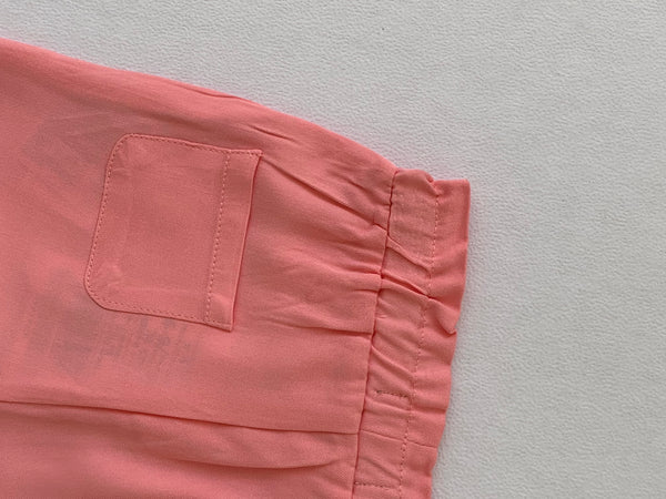 Pantalon con botones de madera color coral para bebe niña | LOSAN