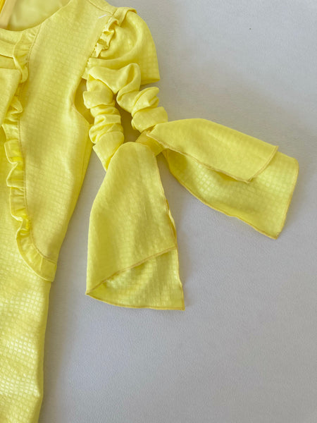 Vestido amarillo con olanes y lazo al frente con adorno para el cabello | Mexcana