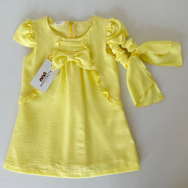 Vestido amarillo con olanes y lazo al frente con adorno para el cabello | Mexcana